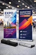 Two custom printed roll up banners with aluminium bases and carry case displayed at a trade show exhibition, portable roller banner stands for business marketing and events UK.